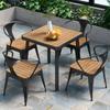Mesa y silla de exterior modernas y sencillas, combinadas, para cafetería, tienda de té con leche, mesa y silla de madera de plástico informales, para restaurante, bar, mesa y silla de exterior.