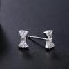 Moda coreana diseño de nicho simple aretes de lazo de plata esterlina S925 aretes plateados de temperamento con sentido de alta gama para mujer al por mayor