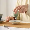 Taza de té pequeña de cerámica de color degradado creativo Juego de dos piezas Taza de té para el hogar Taza de maestro Taza de té giratoria Posavasos para taza de té Taza de agua