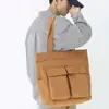 Bolsa de lona vintage Bolsa de ombro portátil de grande capacidade Bolsa de viagem casual masculina e feminina Bolsa tote coreana Ins