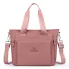 Bolsa de ombro de tecido Oxford de nylon de grande capacidade, versátil para o trajeto diário, leve e adequada para o uso diário; pode ser carregada na mão ou usada como bolsa transversal; ideal para o trabalho ou como uma bolsa de compras