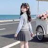 Estilo Academia Niñas 2026 Nuevo Conjunto de Tres Piezas Primavera y Otoño Uniforme JK Chaleco de Punto Camisa Falda Plisada Conjunto Elegante