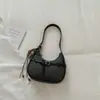 Nuevo bolso de axila estilo francés para principios de otoño de 2026, bolso de media luna de alto valor, bolso de hombro simple, bolso cruzado casual y elegante, moderno