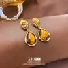 Brincos de Argola Maillard Olho de Tigre Gota d'Água Prata Moda Europeia e Americana Brincos Elegantes Nicho Outono e Inverno Brincos de Alta Qualidade para Mulheres