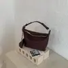Bolsa de axila de nicho de alta qualidade para mulheres, bolsa de palha, novo modelo 2026, bolsa tipo saco simples, bolsa de ombro versátil para o dia a dia