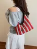 Bolsa de Mão Feminina 2026 Nova Moda Listrada Bolsa Tote de Ombro Casual Trançada Nicho para o Dia a Dia Tendência
