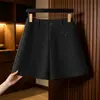 Pantalones cortos de lana para mujer otoño e invierno cintura alta holgados adelgazantes elegantes de lana línea A 2026 nuevo estilo capa base ropa exterior pantalones bootcut