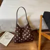 Bolso de mano minimalista de lunares Shuai Mijia, nueva colección 2026, un bolso de mano y bolso de hombro casual único y elegante