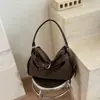 Bolso de mano de diseño nicho estilo coreano para mujer, nuevo de moda verano 2026, bolso simple de gran capacidad para el hombro o la axila