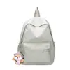 Venta al por mayor de fábrica mochila de nailon ultraligera bolsa de ocio versión coreana de bolsa de viaje de gran capacidad bolsa para estudiantes de secundaria moda