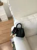 Bolso de Mano de Diseño de Moda de Nicho para Mujer 2026 Nuevo Estilo Coreano Bolso Cubo para Viajes Diarios Bolso de Hombro Único Cruzado Transfronterizo