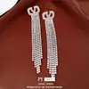 Brincos de Tarraxa Simples com Borla Oca Oval Inlaid de Diamante Agulha de Prata Leve Luxo Sensação de Alto Padrão Brincos Modernos Europeus Americanos Ornamentos Individuais para Orelha