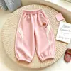 Pantalones deportivos infantiles de estilo europeo y americano, versión coreana, diseño color block, pantalones deportivos casuales para primavera y otoño, con puños elásticos