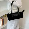 Bolso de mano de axila estilo coreano para otoño, moderno bolso de gamuza para mujer, versátil para el uso diario, nuevo modelo 2026, terciopelo exquisito de nicho para ir al trabajo