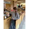 Procesamiento OEM para cárdigan de punto trenzado gris de manga larga y cuello redondo para otoño e invierno para mujer, tejido interior suave y estilizado