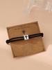 Pulsera de cuerda de mano de Milán ajustable con cruz de aleación nueva de Europa y Estados Unidos para hombres y mujeres, joyería al por mayor exclusiva transfronteriza