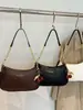 Moda estilo coreano simple y elegante color liso gran capacidad otoño 2026 nuevo popular bolso cruzado de hombro para mujer