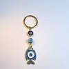 Colgante de Serie Ojo de Diablo Transfronterizo Europeo y Americano Colgante de Llavero de Joyería de Animales Ojo de Hueso con Goteo de Aceite Accesorios de Aleación para Mujeres