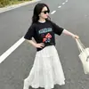 Roupa Infantil Estilo Coreano Verão Novo Estilo Camiseta Fofa para Meninas Estampa de Cogumelo Manga Curta Saia Branca com Laço Conjunto Casual