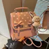 Mochila de lunares con lazo transfronteriza para mujer, nueva y versátil bolsa escolar para estudiantes 2026, bolso de mano para el trabajo, bolso de hombro, bolso cruzado
