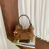 Bolso de Mano Retro de Ante para Mujer 2026 Nuevo Otoño Estético de Gama Alta Melanoides para el Trabajo Bolso de Hombro Individual Cruzado