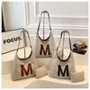 Bolsa Tote de Luxo Transfronteiriça 2026 Nova Coleção Primavera Vintage Grande Capacidade Moda Versátil Nicho Bolsa de Ombro de Mão