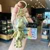 Liquidación de colección de llaveros colgantes de personajes de dibujos animados IP auténticos, lindos colgantes de estrella-luna-conejo para bolsos de niñas, stock para vendedores ambulantes