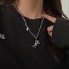 Collar de moda estilo hip hop para mujer, estilo frío, con diseño de nicho de circonita de color de alta calidad y cruz de acero de titanio dulce y fresco.