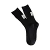 Calcetines de hilo grueso estilo japonés Harajuku para mujer, moda otoño e invierno, tela en el talón con logo, calcetines de longitud media a la pantorrilla, patrón vertical simple, color liso, calcetines de felpa
