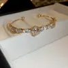 Pulsera Abierta de Flor de Zircón con Forma de Gota de Agua Chapada en Oro Real de 14k Pulsera de Lujo Ligero de Gama Alta Pulsera Exquisita y Versátil para Mujer