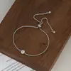 2025 Novo Estilo Zircônia Incrustada Temperamento Joia de Mão para Mulheres Design de Nicho Anel Pulseira de Puxar Ajustável Atacado