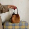 Bolso pequeño súper popular para el trabajo, nuevo bolso de cubo de gamuza para mujer 2026, de hombro y cruzado para ir al trabajo