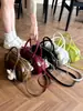 Bolso de mano para mujer de color liso, muy elegante y único, nuevo bolso tipo almohada verano 2026, bolso de axila de nicho versión coreana de moda