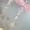 Europa y Estados Unidos joyería transfronteriza dulce viento fresco trébol de cuatro hojas cadena de perlas colgante pequeño fresco lazo de cinta adornos para bolsas