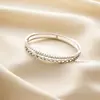Pulsera de acero de titanio de doble capa con círculo hueco de diamante y diseño de ola para mujer, con cierre de hebilla de taladro, no se decolora, venta al por mayor de fabricantes