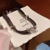 Collar de Lazo de Cuero Negro para Mujer Correa para el Cuello Estilo de Lujo Ligero de Nicho Cadena para el Cuello de Chica Popular Cadena para Clavícula Picante Accesorios al por Mayor