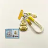 Colgante redondo bañado en oro juego de caja de regalo múltiples patrones disponibles recuerdo para festivales y viajes con coche regalo para actividades llavero colgante