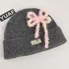 Gorro de tricô estilo coreano com mistura de lã, inspirado na dopamina, com laço, um chapéu de inverno quente e protetor de orelhas para mulheres, adequado para estudantes