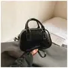 Bolsa de Mão Fashion Bag Bowling Bag para Mulheres 2026 Início da Primavera Nova Estilo Coreano Bolsa de Ombro Simples Design de Nicho Bolsa Transversal para Mulheres