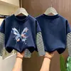 Camiseta de manga larga para niña, nuevo estilo primavera/otoño 2026, base infantil moderna y linda, conjunto de otoño de algodón puro, top tipo dos piezas
