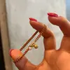 Popular Pulsera de Cuerda Trenzada Roja de Doble Hilo con Pequeño Colgante de Despertar del León de Xiaohongshu Diseño Otoño e Invierno Navidad Joyería de Mano Envío Directo