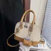 Bolsa de Concha Retro de Nicho Transfronteiriça para Mulheres Nova Cor Combinada Versátil Bolsa de Mão de Alta Qualidade para Comutação Ombro Cruzada