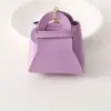 Nuevo Monedero Creativo Color Caramelo Llavero de Auriculares Moda Femenina Bolso de Almacenamiento de Cuero Versátil Colgante Regalo