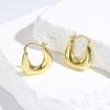 Aretes huecos fotosensibles de alta gama de lujo ligero europeo y americano joyería para damas aretes de cobre huecos en forma de U retro al por mayor