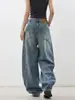 Jeans azules estilo americano con dobladillo curvo para mujer, otoño e invierno 2026, pantalones holgados de pierna ancha con un diseño único, pantalones de pierna ancha de tiro alto, nuevo estilo