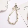 Cadena para Teléfono de Perlas en Forma de Corazón Estilo Nuevo Chanel, Cadena de Mano de Perlas de Vidrio, Colgante Hecho a Mano con Perlas, Accesorios DIY al por Mayor