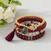 Bestseller transfronterizo estilo bohemio ojo turco borla colgante pulsera multicapa cordón elástico pulsera de cuentas