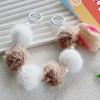 Otoño e Invierno nuevo pompón de piel con cuentas de perlas cadena portátil adornos de bolso funda para teléfono móvil cadena colgante cadena corta para muñeca para mujer