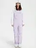 Liquidación de pantalones de esquí tipo peto para mujer, nuevos, impermeables y cálidos, chaqueta de esquí profesional para hombre, comercio exterior