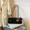 Bolso de mano retro de moda con estampado de leopardo, un bolso de axila de nicho y elegante para mujer, con un diseño moderno y atractivo, un estilo simple y versátil, y adecuado para ir al trabajo